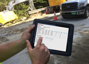 Worker on iPad closeup